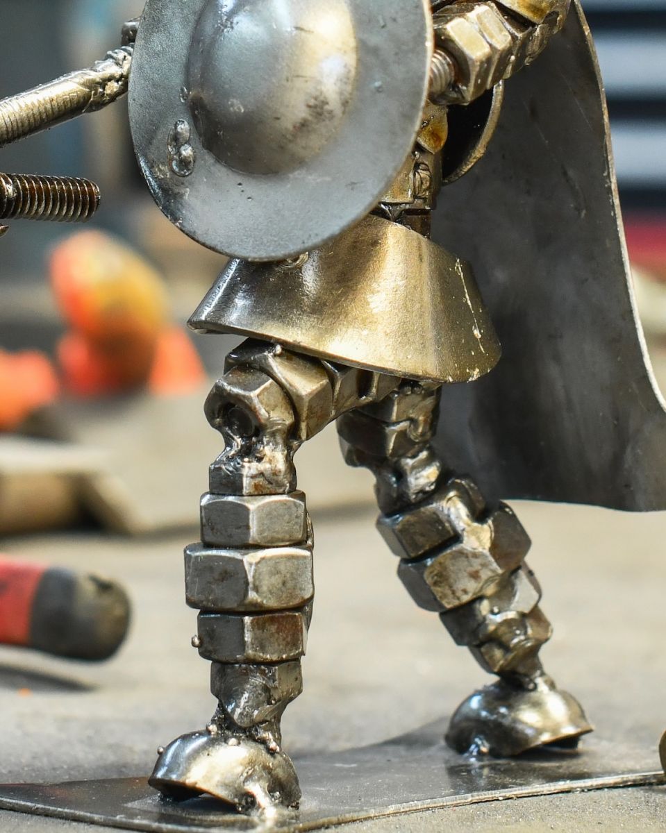 Close up of intricate body detail on scrap metal art sculpture