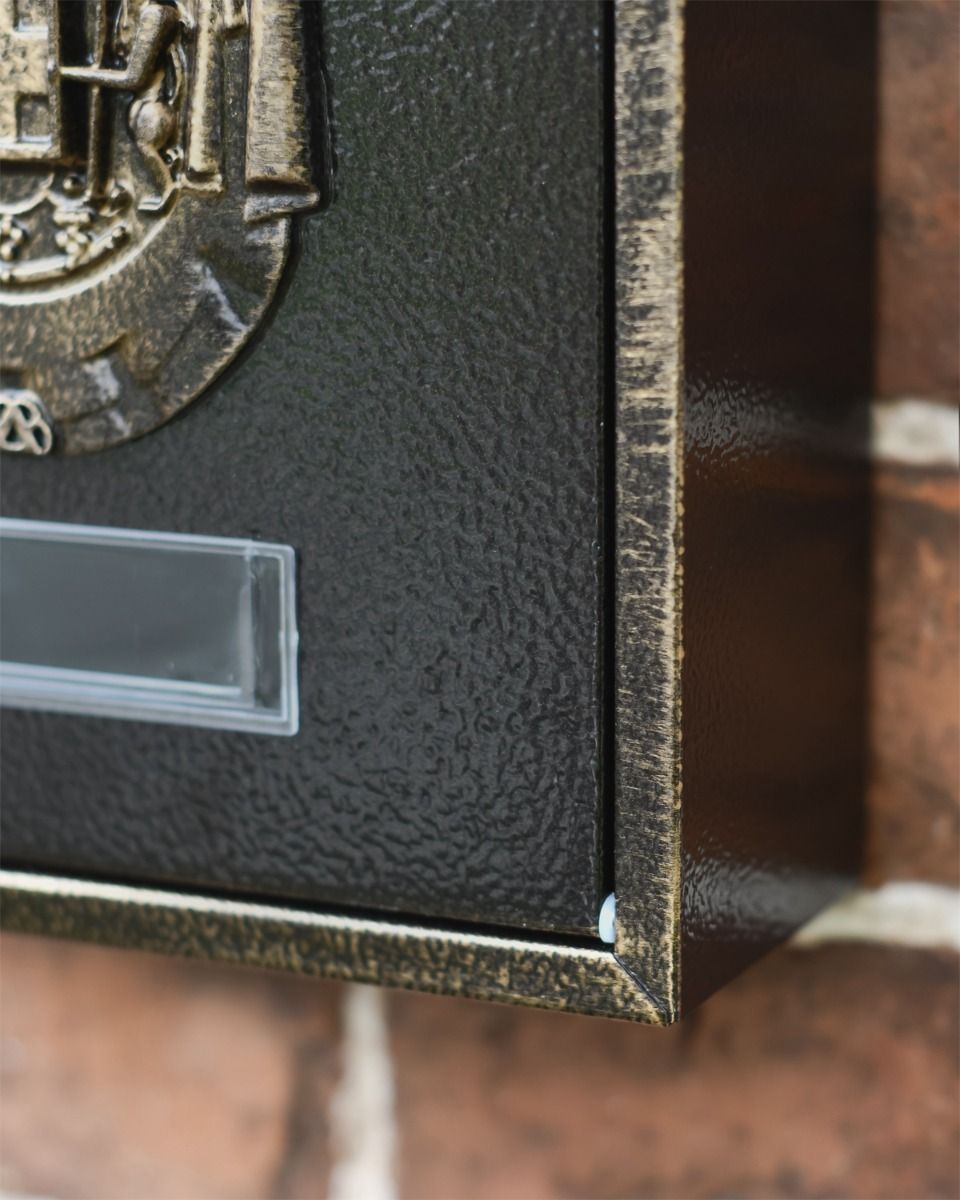 Gold and Black Close up of Post Box 