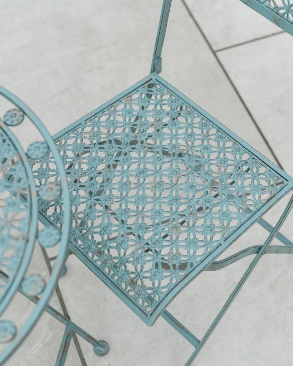 Close up of intricate seat detail on garden two seater table and chairs set