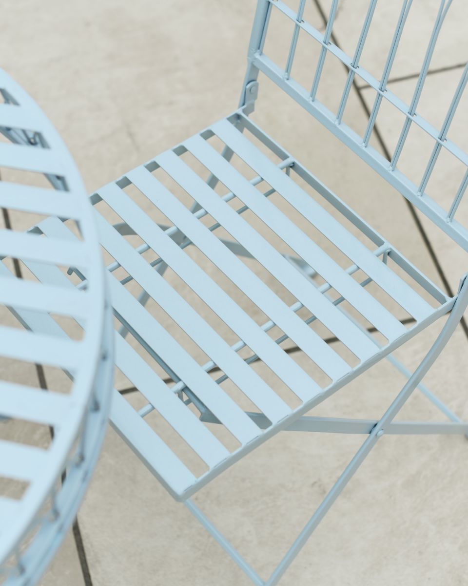Close up of intricate seat detail on outdoor two seater table and chairs set