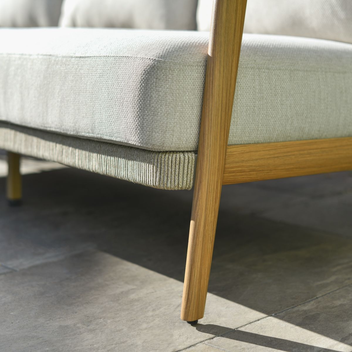 Close up of wood effect detailing on six piece outdoor lounge furniture set Close up of wood effect detailing on six piece outdoor lounge furniture set