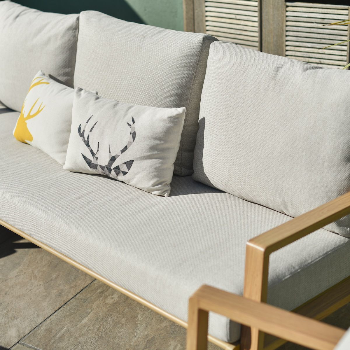Close up of three seater sofa on five seater outdoor lounge set Close up of three seater sofa on five seater outdoor lounge set