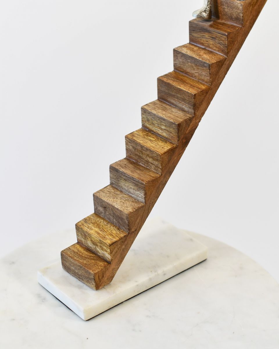 Close up of mango wood stairs detail and marble base