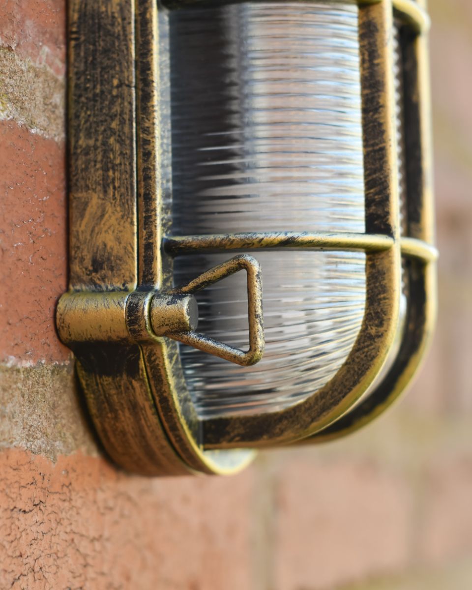 Close Up Details On The Brushed Brass Bulkhead Wall Light