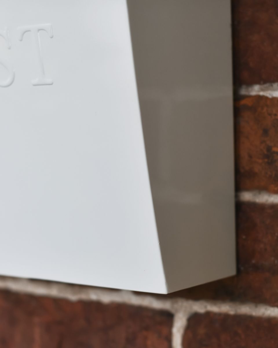 Close Up Of The Finish On The White Billingham Post Box