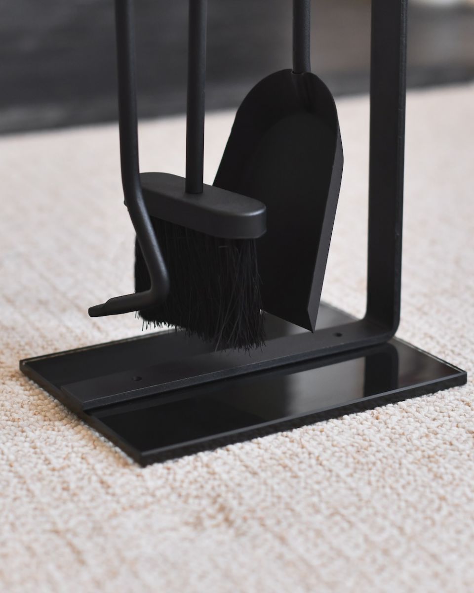 Close up of tools with freestanding base on fireside companion set