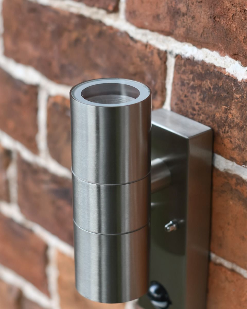 Close up Of Contemporary Stainless Steel Downlighter Wall Light