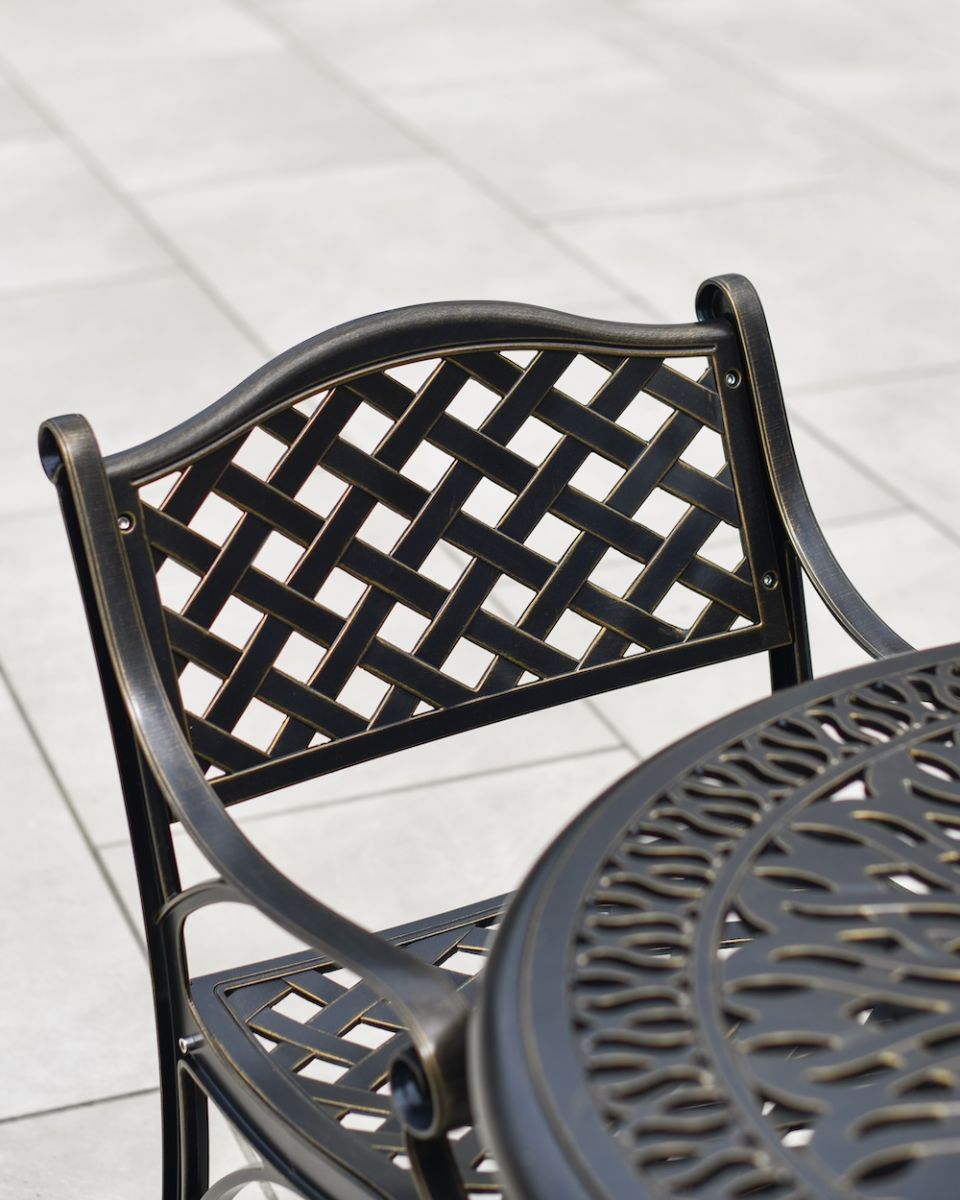 Close up of chair lattice detail on 5 piece outdoor dining set