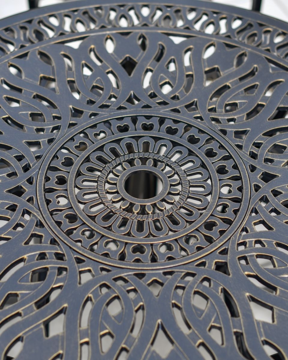 close of up table top detail with umbrella hole on round aluminium dining table