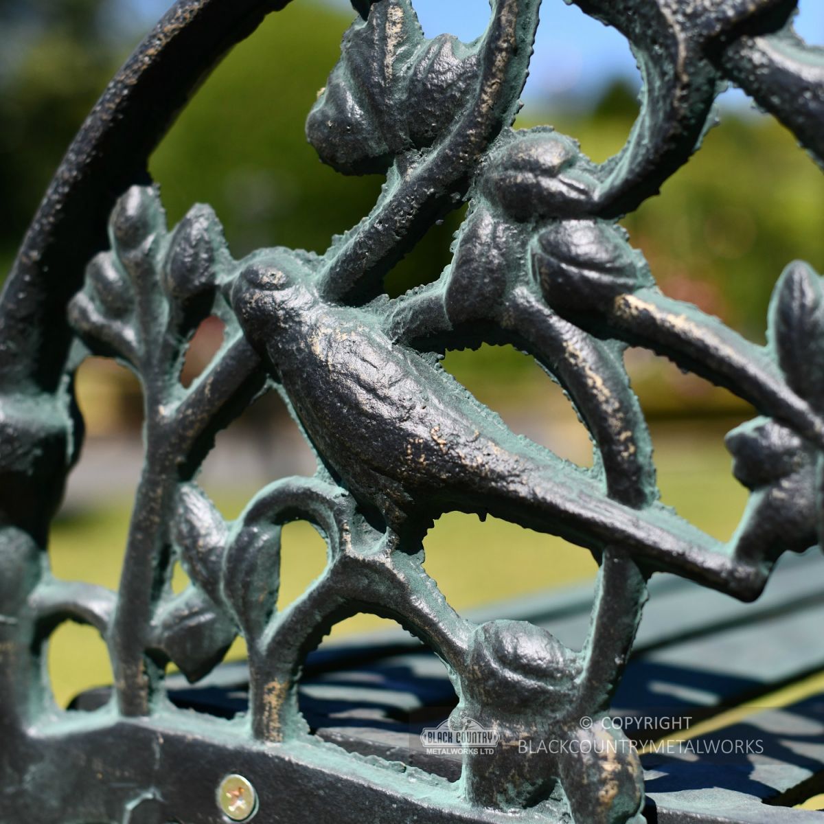 Close Up Ornate Scroll Work On Iron Garden Bench