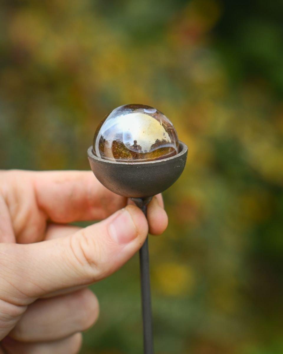 Close up scale image of marblw on suncatcher plant pot stake