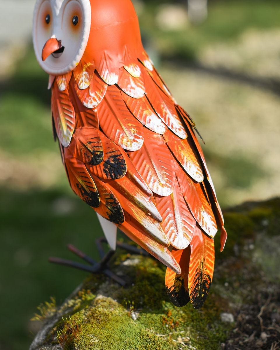 Close up of colourful ginger feathers on owl ornament