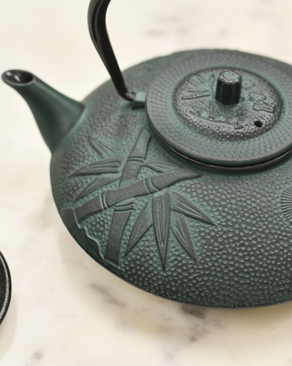 Close Up of Bamboo Design on Dark Green Teapot 