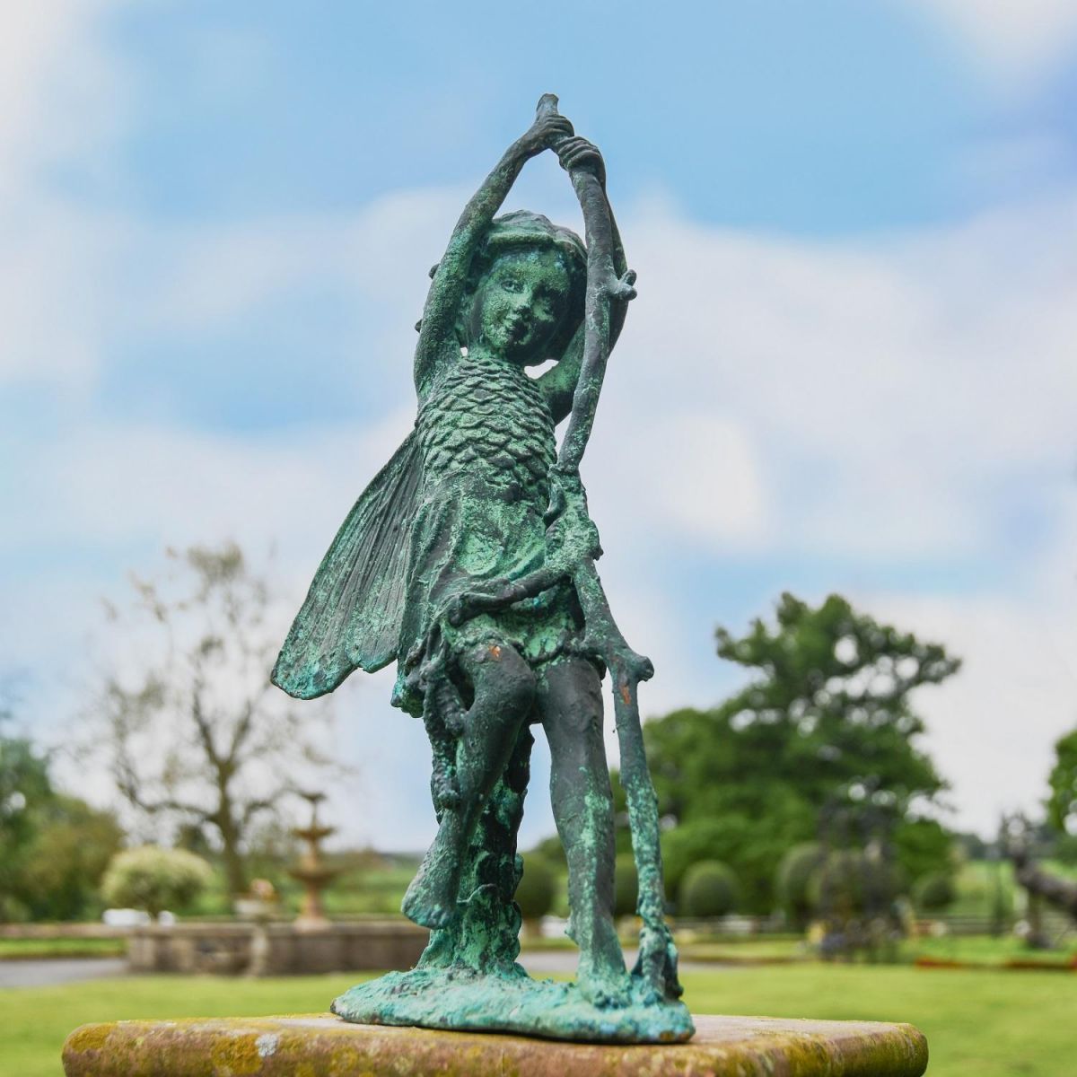 Verdigris Cast Iron Woodland Fairy Sculpture in Garden Setting