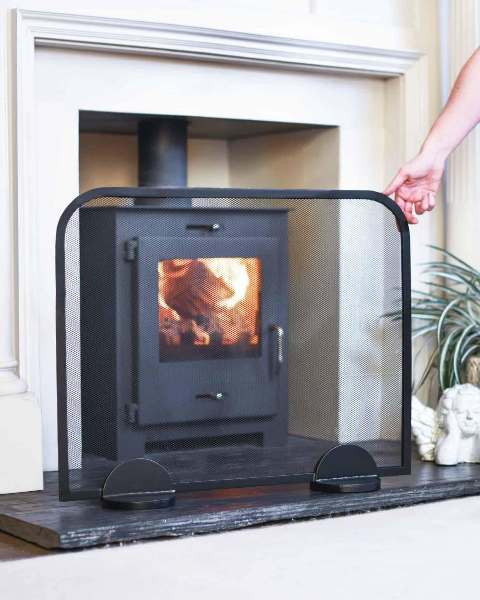 Scale Shot of Contemporary Black Arched Single Panel Fireguard with Mesh