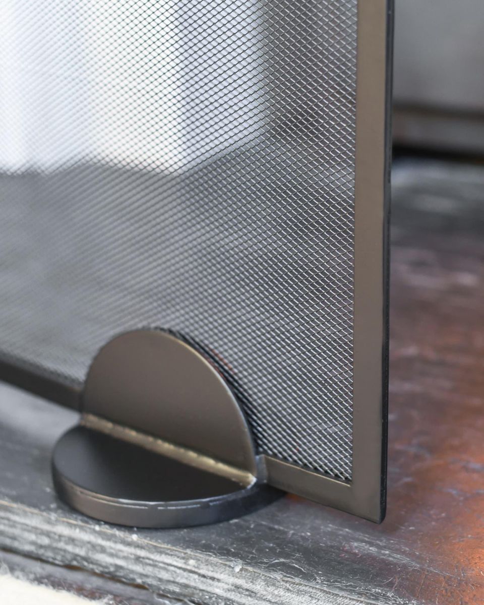 Close-Up of Midnight Black Finish on Contemporary Arched Single Panel Fireguard with Mesh