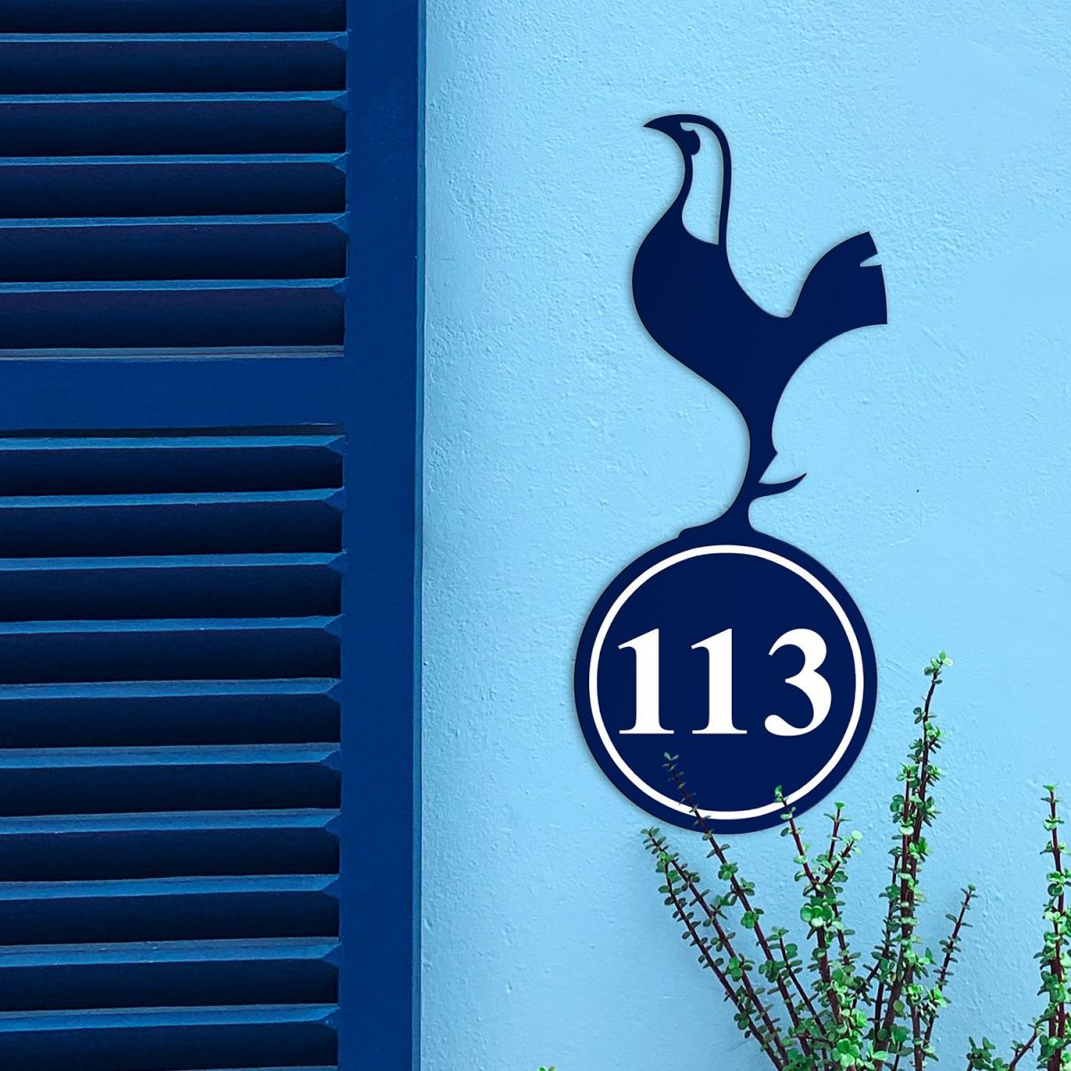 Contemporary Cockerel Iron House Number Sign in Situ on a Blue Wall 