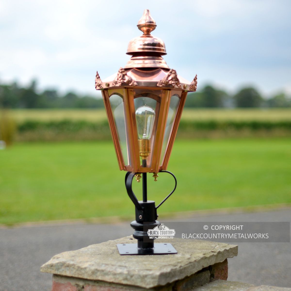Copper Hexagonal Pillar Light Set in situ on a Brick Pillar