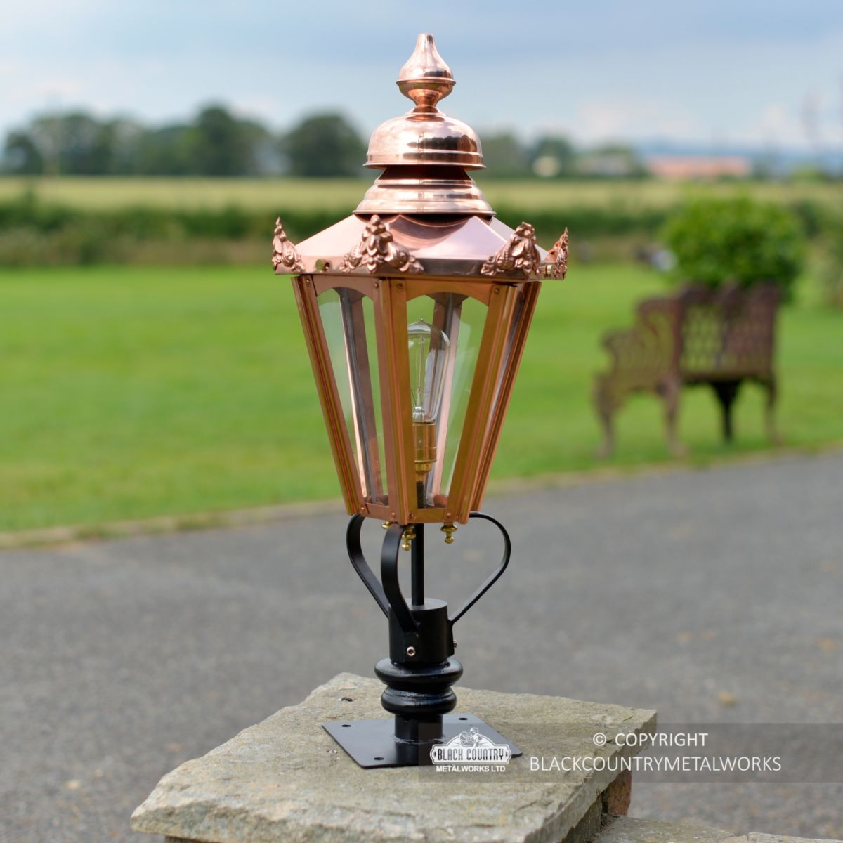 Copper Hexagonal Pillar Light in situ in the garden