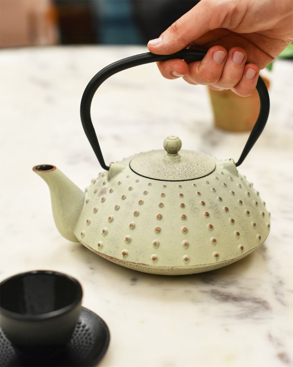Cast Iron Teapot In Use 