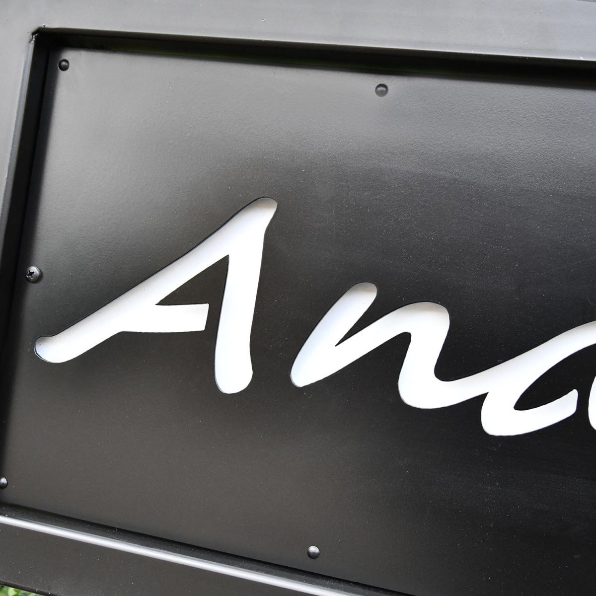 Close-up of the White Text on the Sign