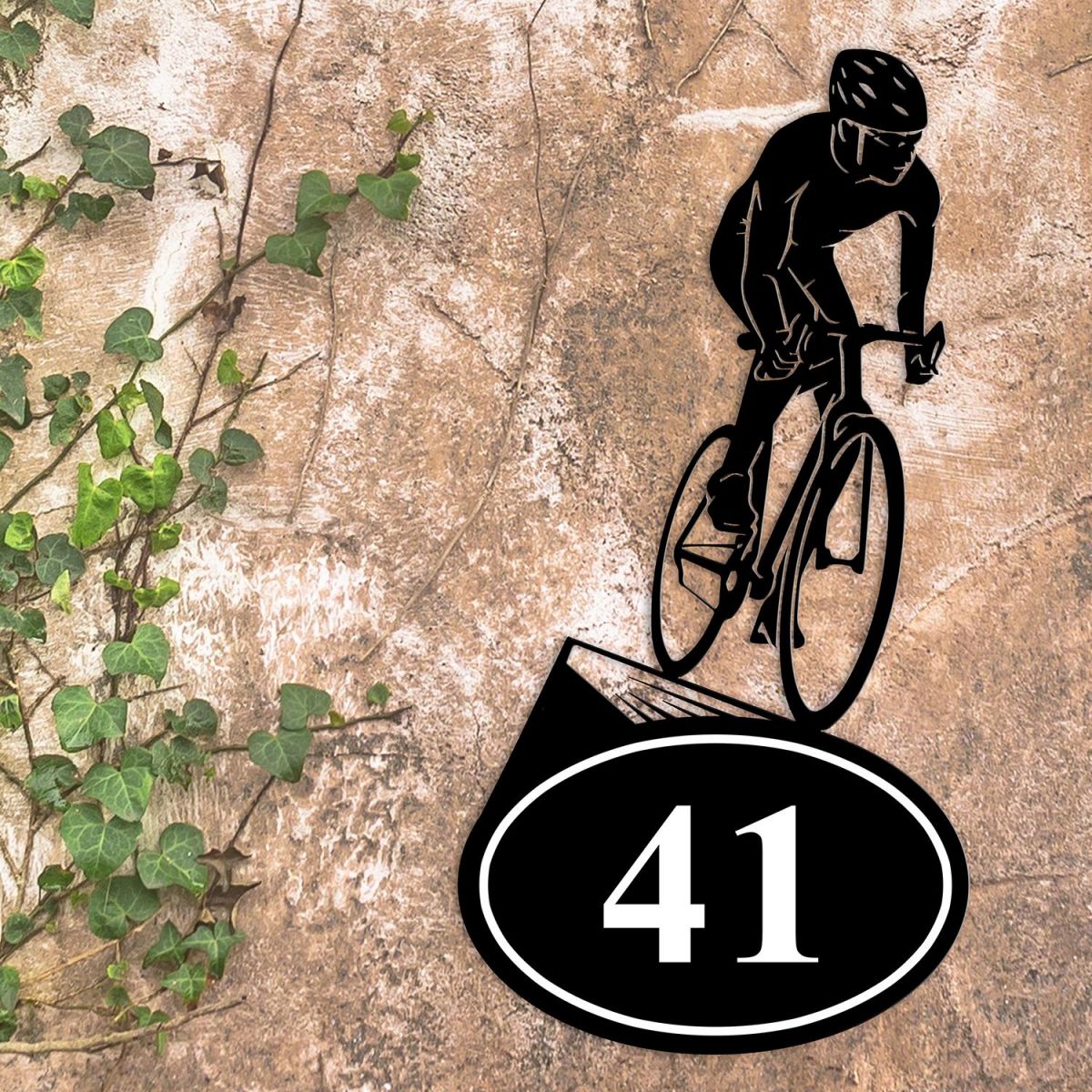 Cyclist Iron House Number Sign in Situ on a Rustic Wall 