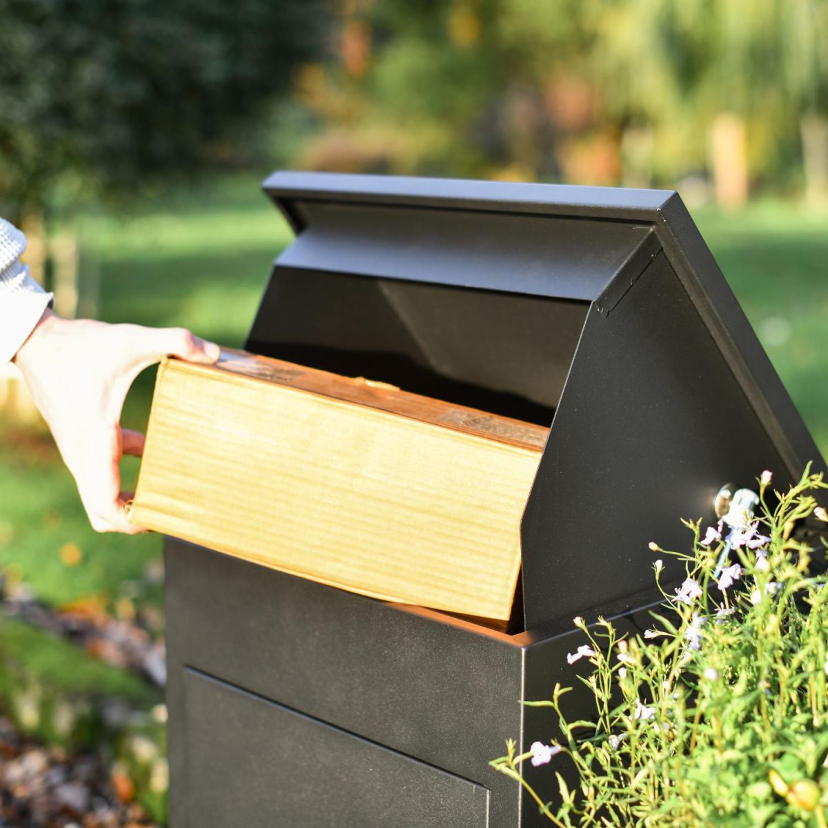 Lid Opening in Use on Deluxe Black Bexley Free Standing Parcel Box