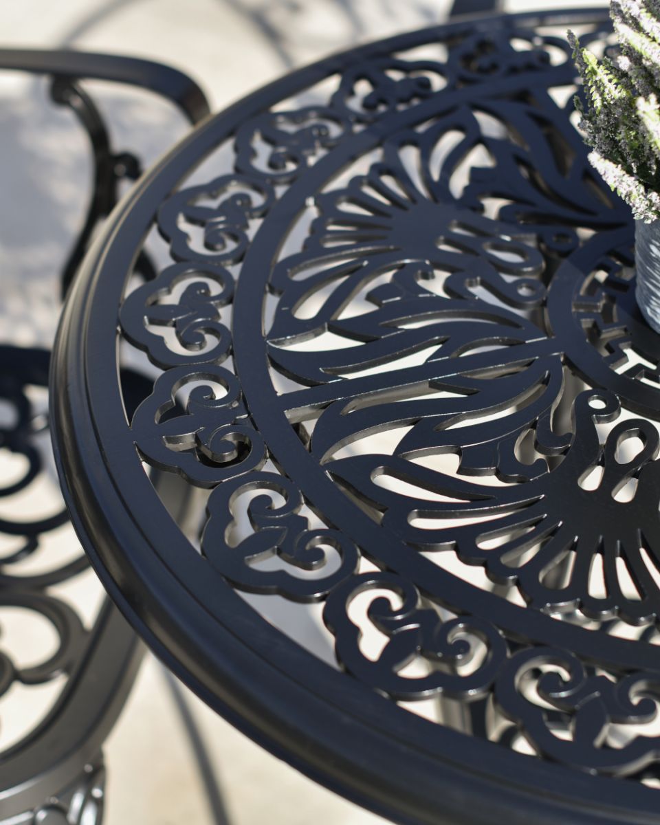 Aged Black Harlington Ornate Dining Set Up Close