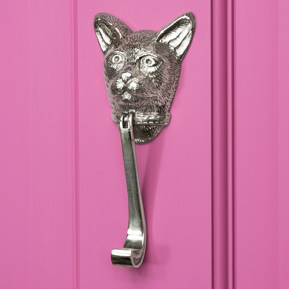 Bright Chrome Cat head door knocker on bright Pink Door