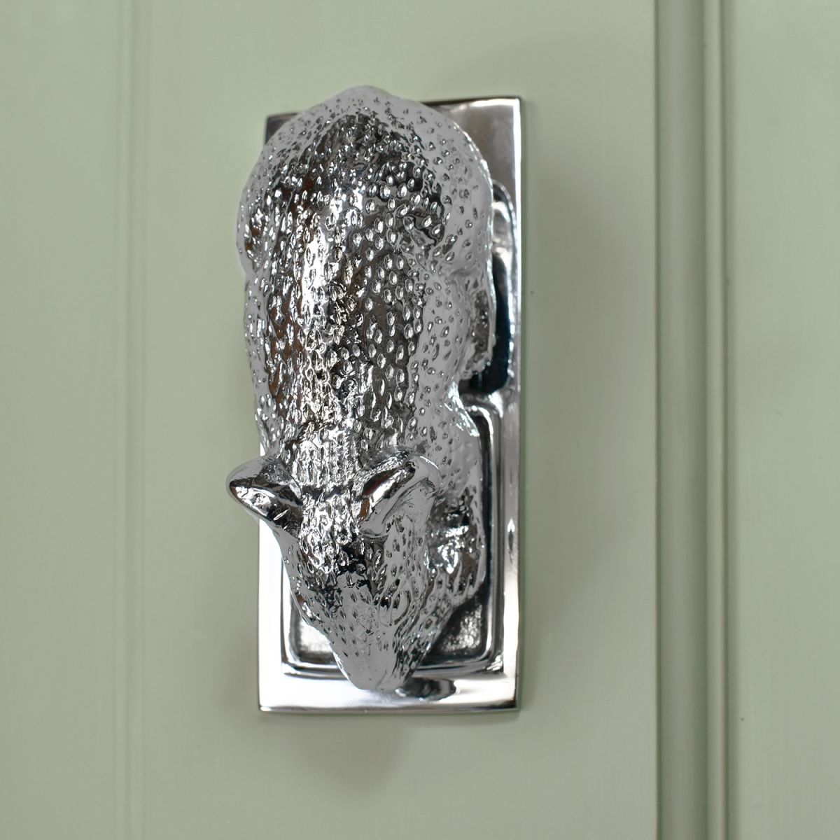 Bright Chrome Mouse Door Knocker on Green door