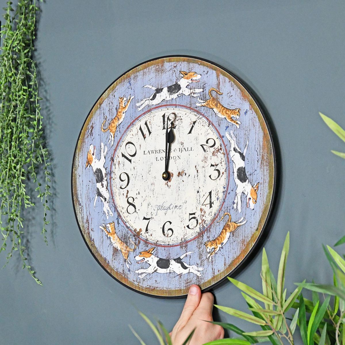 Dogs and Cats Playtime Rustic Wall Clock on a Blue Wall