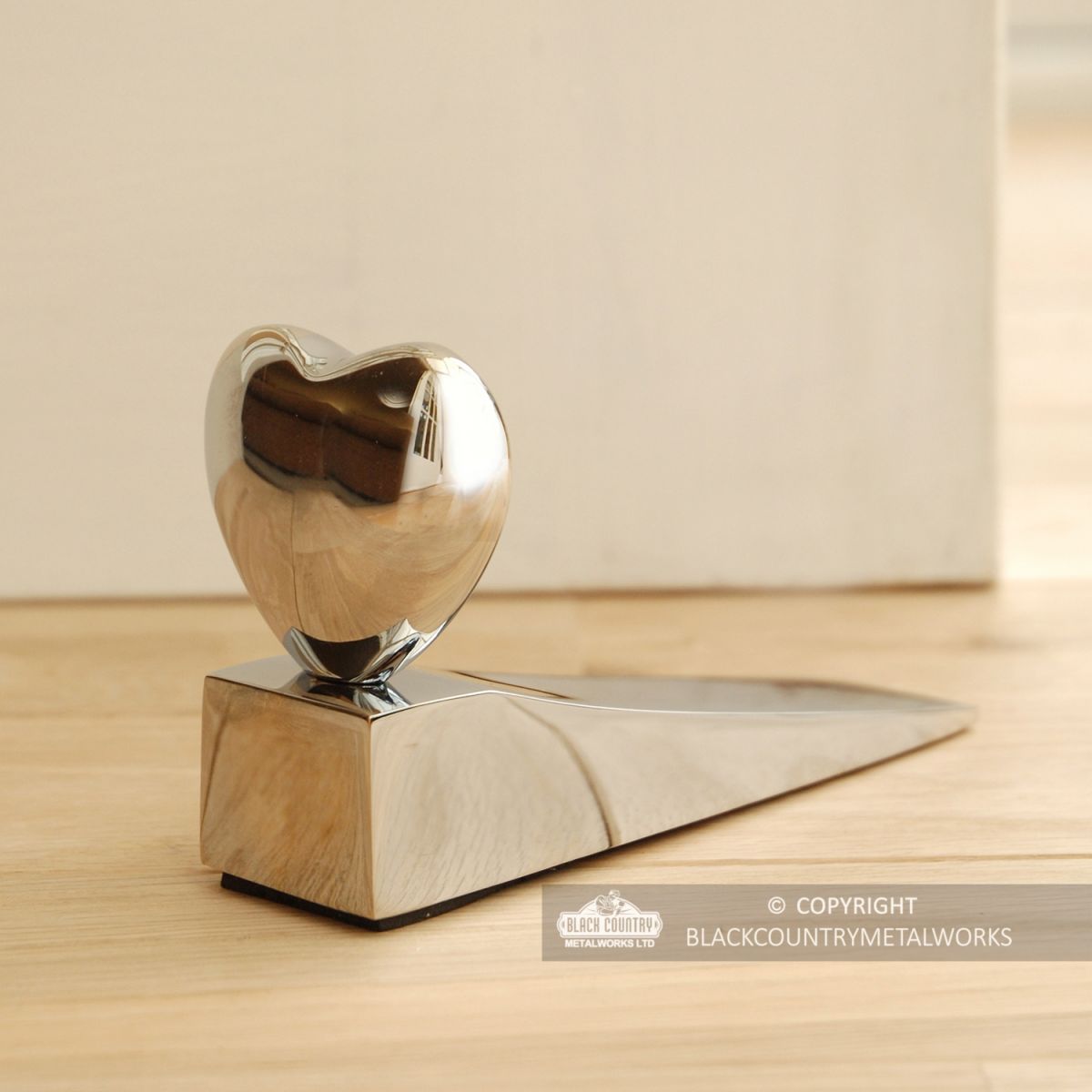 Chrome Chubby Heart Door Wedge in Situ in the house