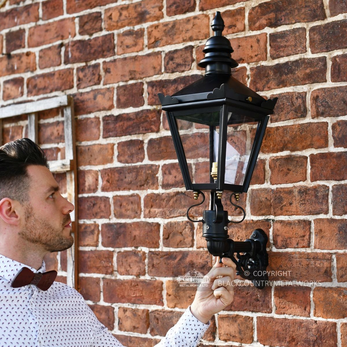 Exterior wall light mounted on brick wall