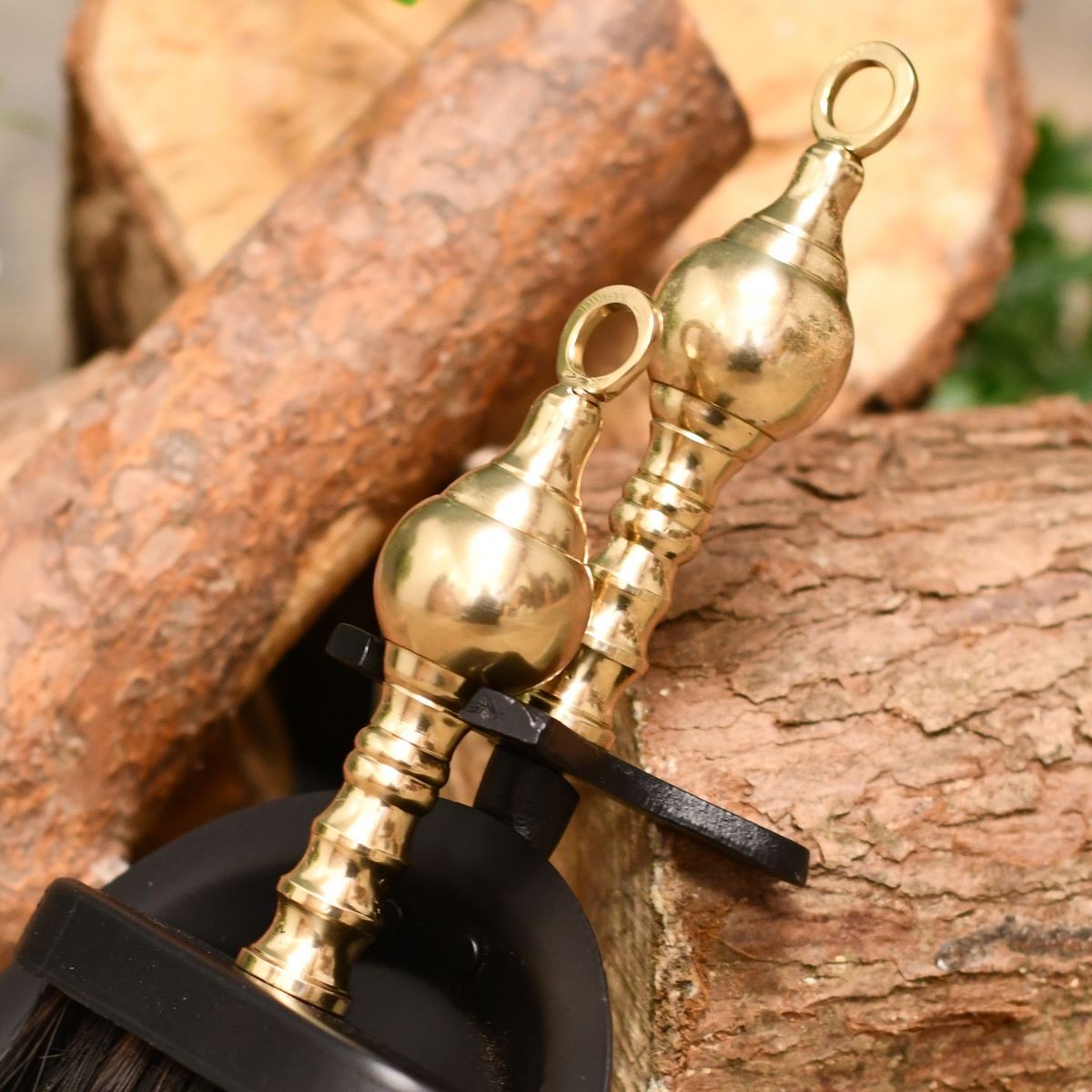 Detailed image of solid brass handles on brush & pan set