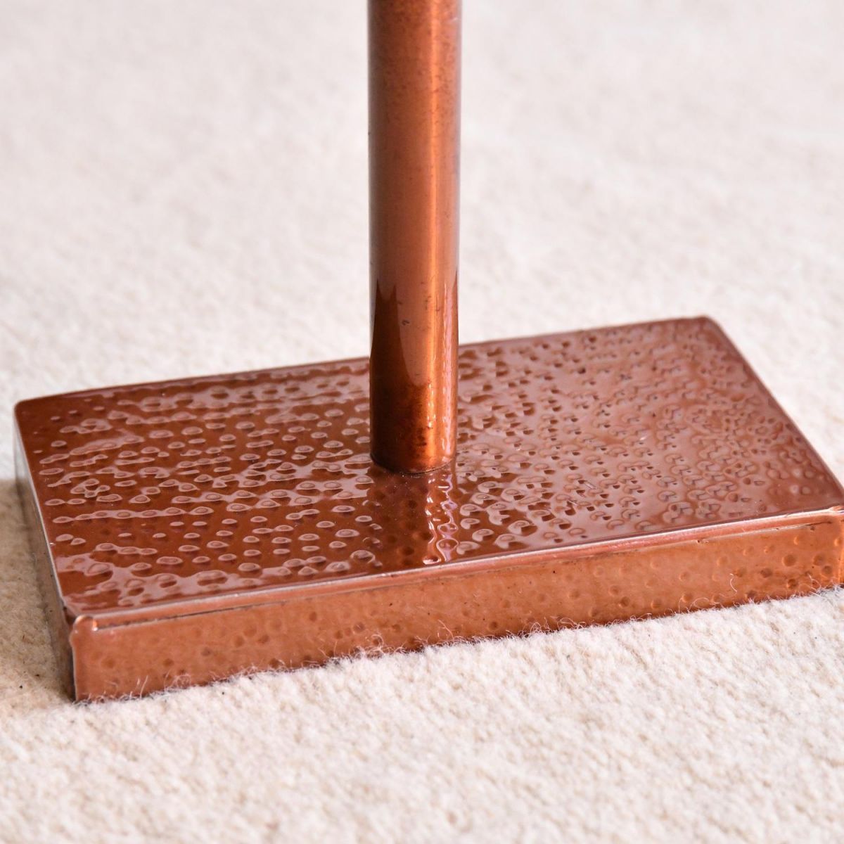 Close up of rectangular hammered base