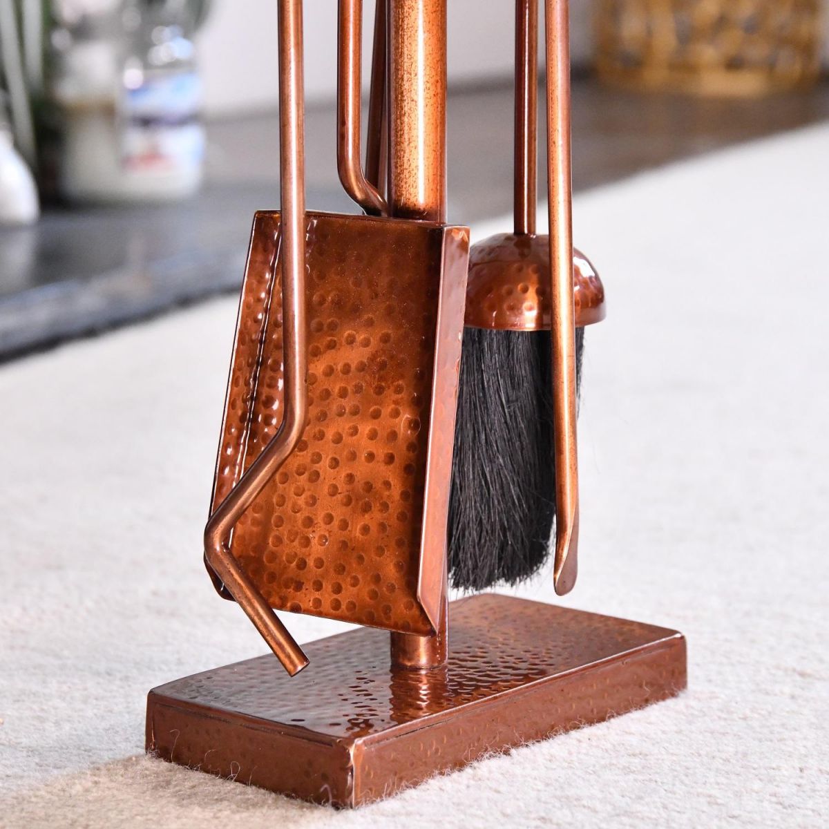 Close up of Antique Copper Hammered Companion Set 