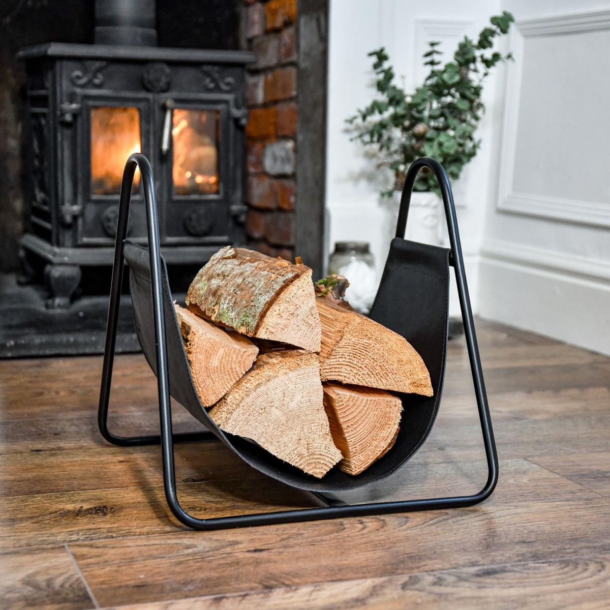 Black Steel & Black Leather Log Holder on Wooden Floor