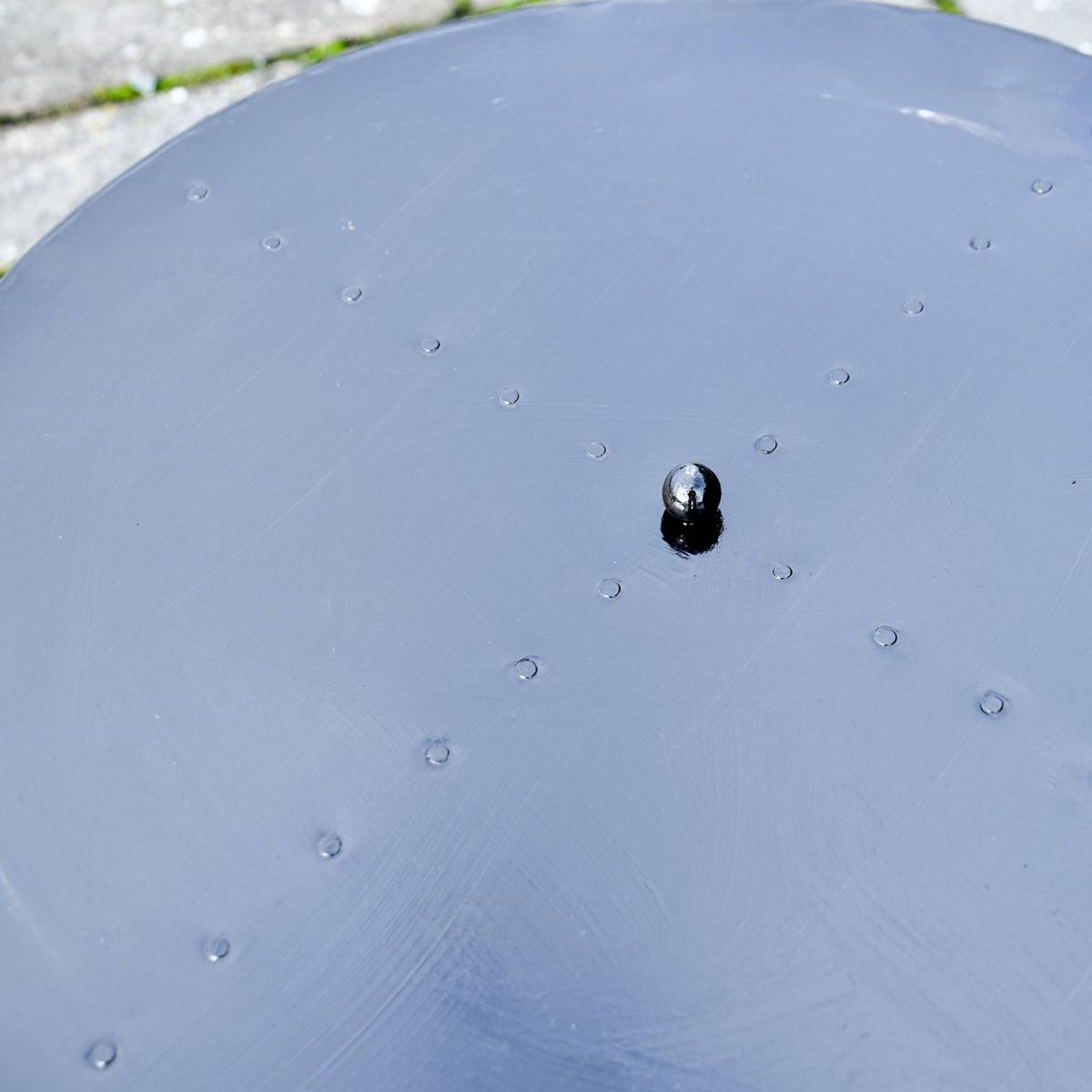 Close up of steel lid and ball handle