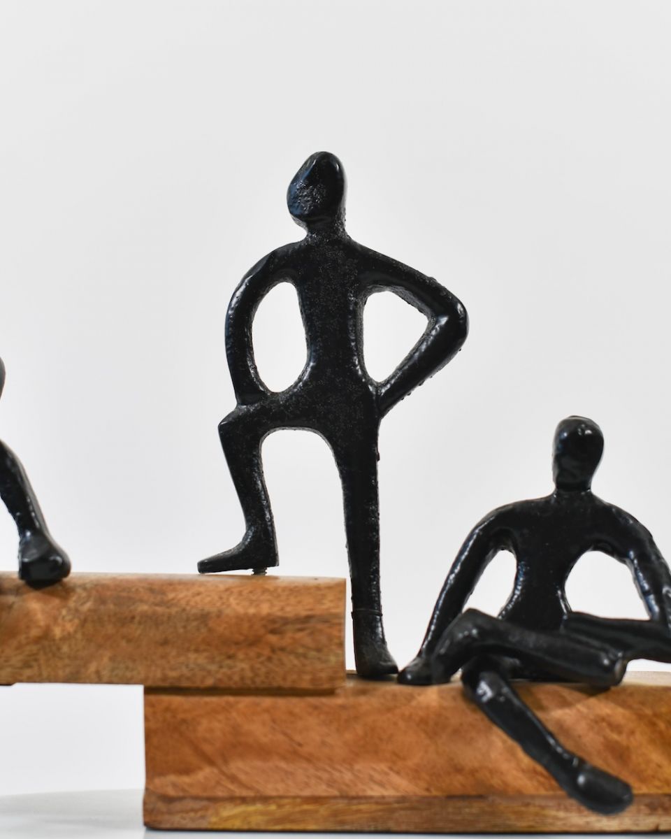 Close up of black cast aluminium figure on art sculpture