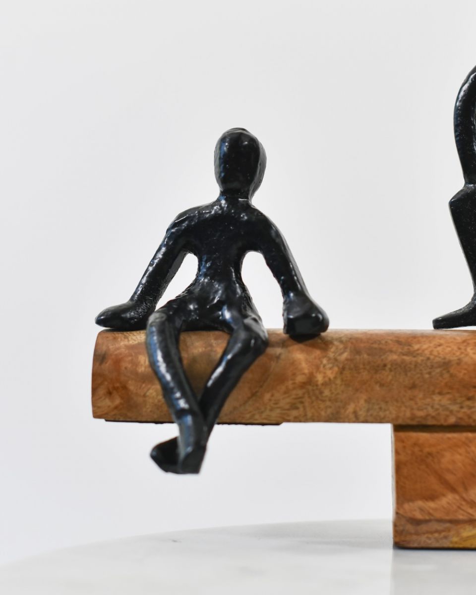 Close up of black cast aluminium figures on home decor art sculpture