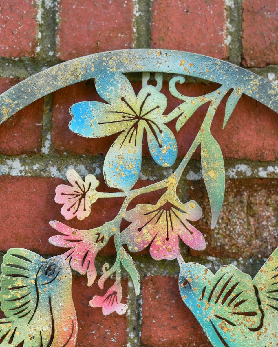 Close up of floral detail on garden wall art