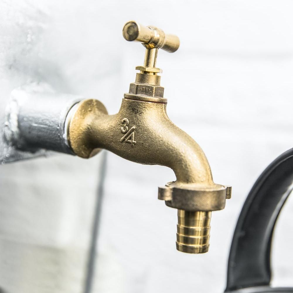 Brass Tap on the Galvanised Water Butt