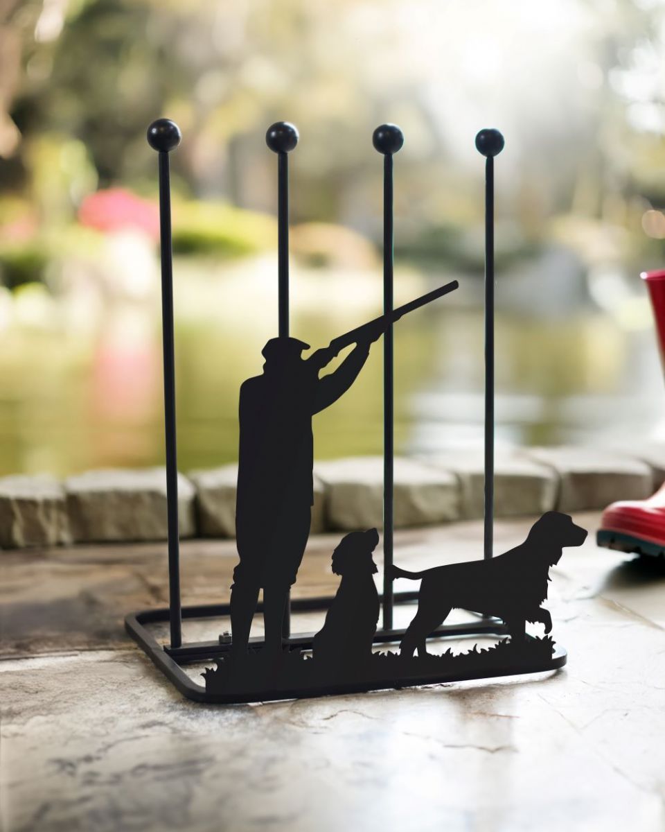 Black boot rack with gunman and dog silhouettes as decoration