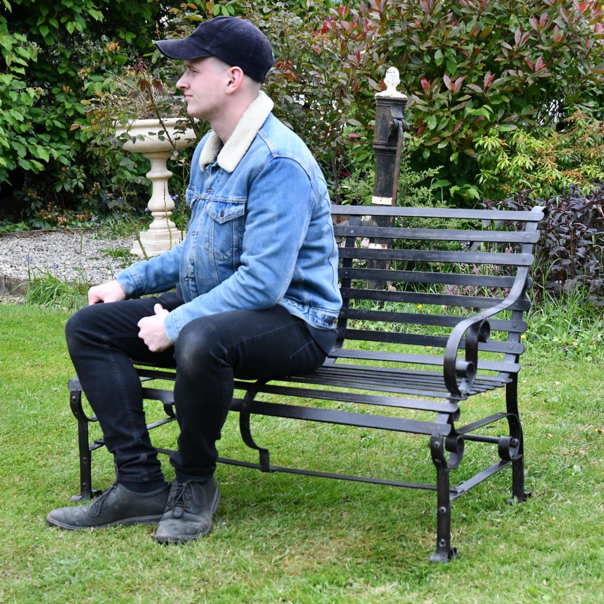 Black Two Seater Park Bench in Use