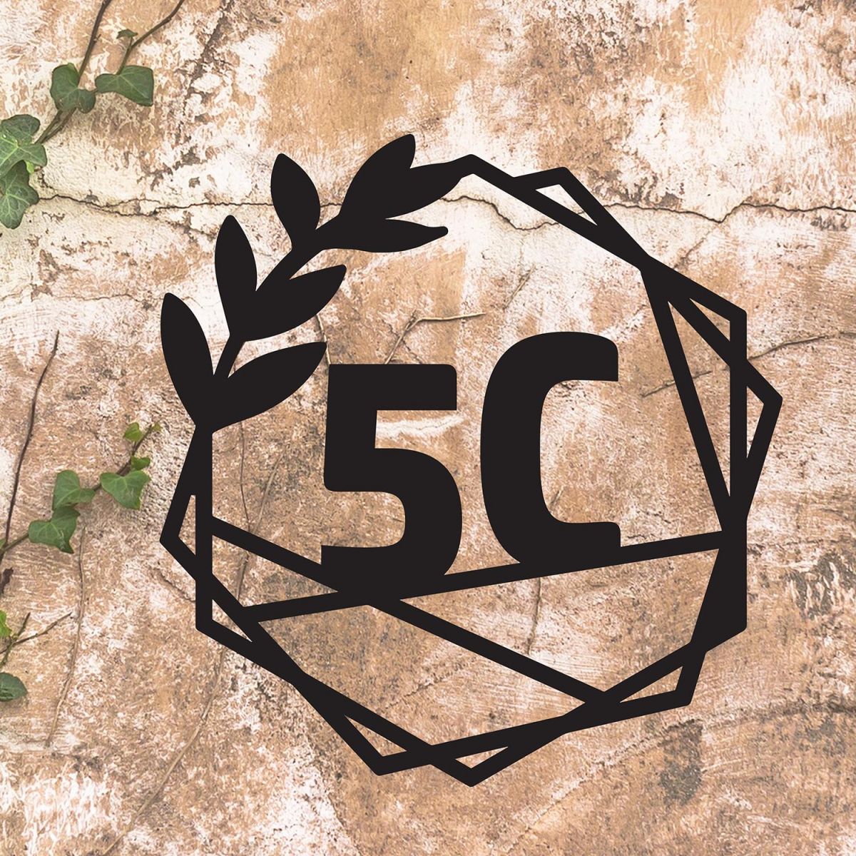 Geometric Leaf House Number Sign on a Rustic Wall