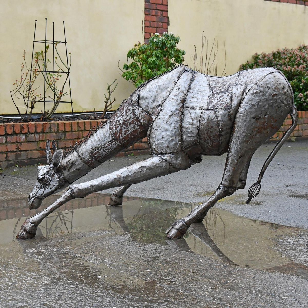 View of the Side of the Drinking Giraffe Sculpture