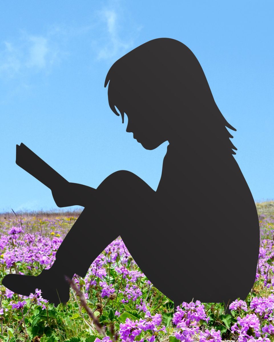 Girl Reading Steel Silhouette sitting on flowers