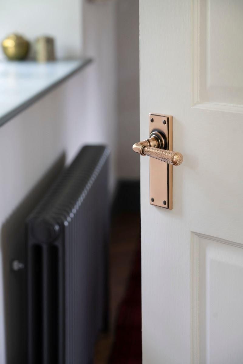 Hammered Polished Copper Lever Latch Door Handle on Door