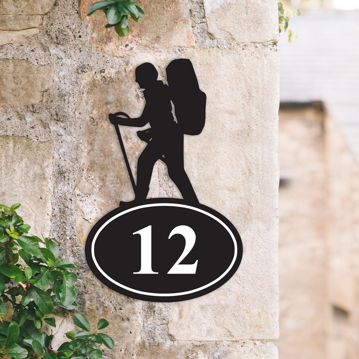 Hiking Iron House Number Sign on a Garden Wall