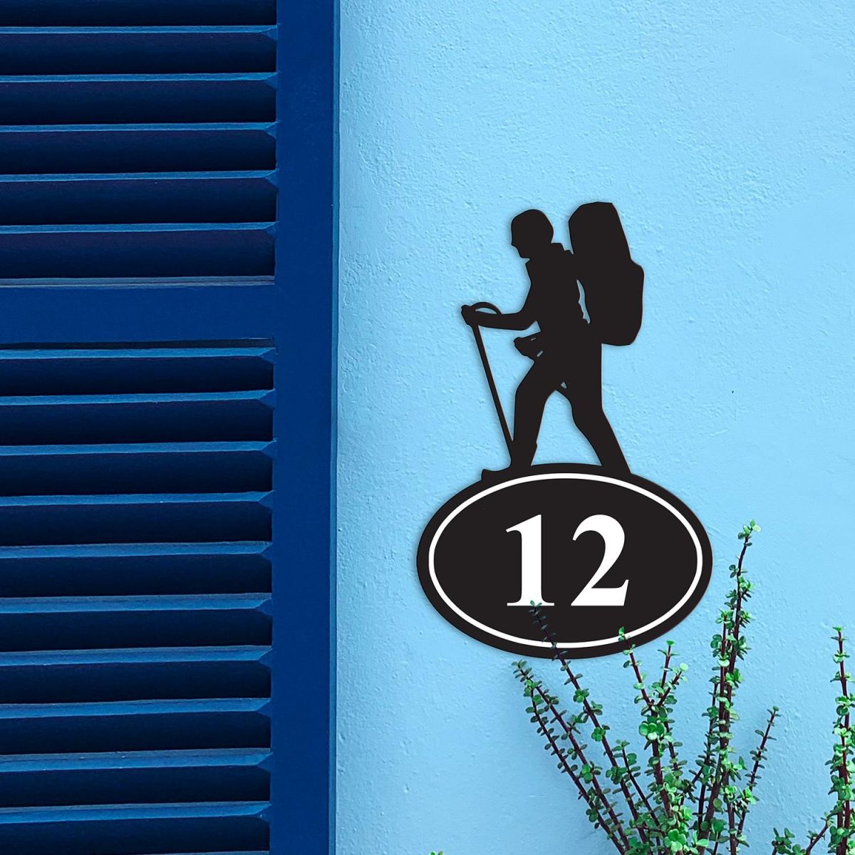Hiking Iron House Number Sign in Situ on a Blue Wall